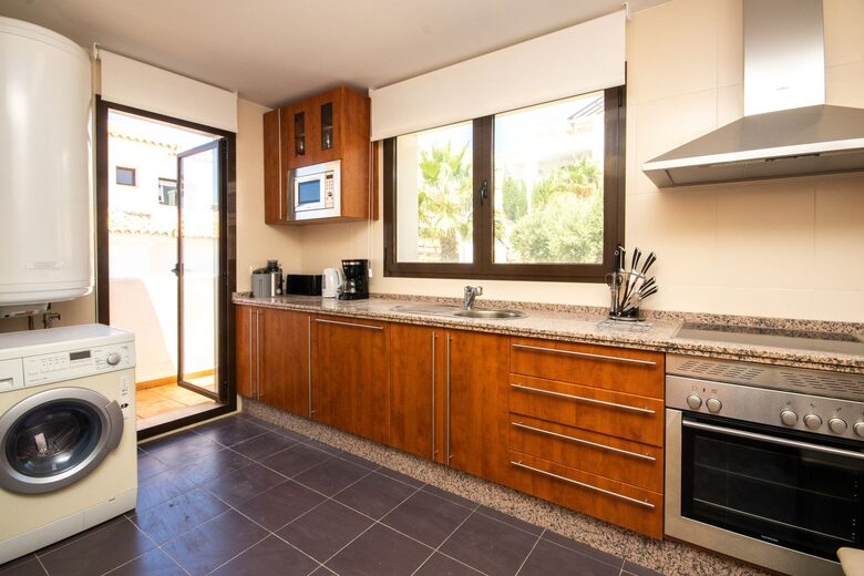 Well equipped kitchen with hi-end appliances and washer/dryer