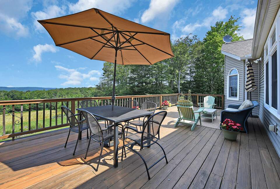 DECK WITH DINING TABLE, SITTING AREA AND GRILL