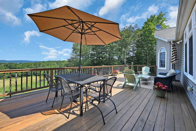 DECK WITH DINING TABLE, SITTING AREA AND GRILL