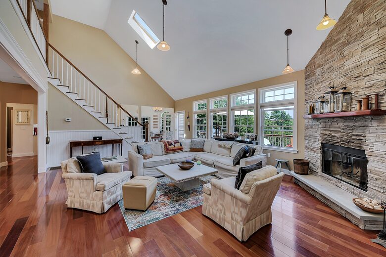 LIVING ROOM WITH FIREPLACE AND TV