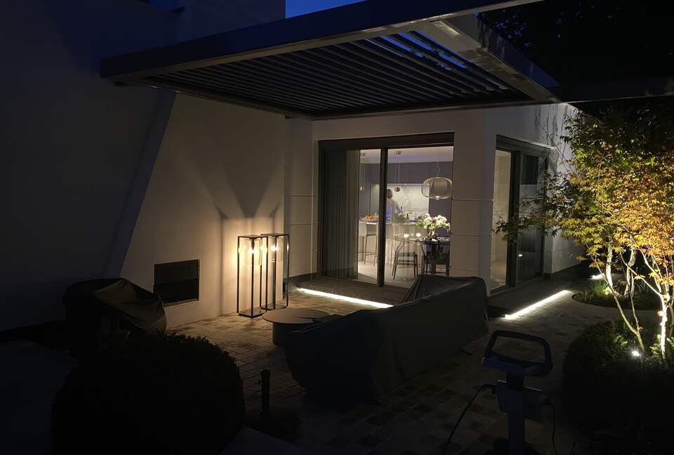 Outside fireplace under pergola