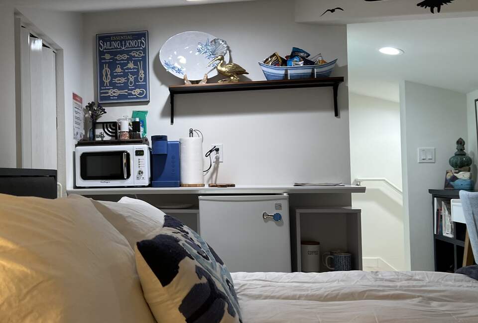 Detached bedroom above garage with kitchenette.