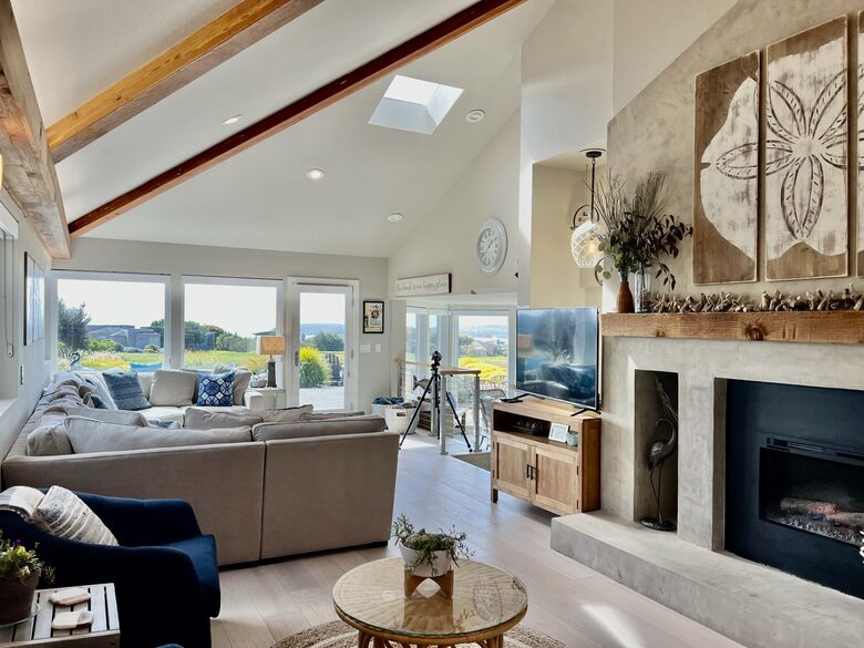 Large sofa, telescope, smart TV and electric fireplace.