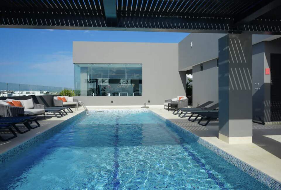 Singular Dreams Modern Beach Condo | Ocean-view with roof deck, pool, & private balcony - walk to beach - Playa del Carmen, Mexico