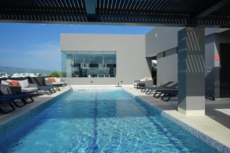 Singular Dreams Modern Beach Condo | Ocean-view with roof deck, pool, & private balcony - walk to beach - Playa del Carmen, Mexico