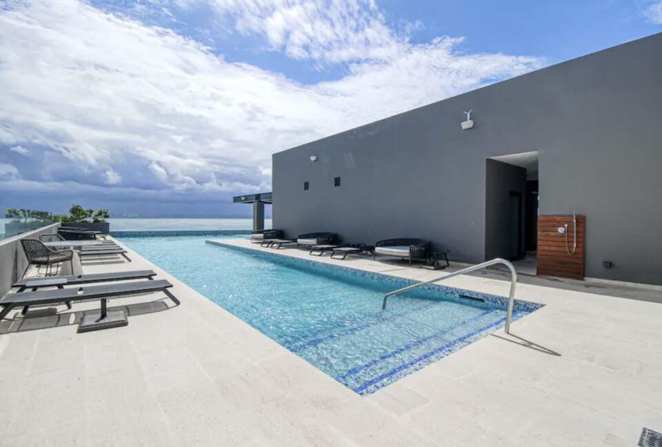 Singular Dreams Modern Beach Condo | Ocean-view with roof deck, pool, & private balcony - walk to beach - Playa del Carmen, Mexico