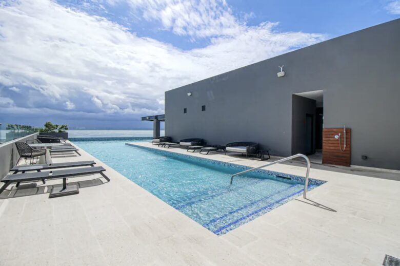 Singular Dreams Modern Beach Condo | Ocean-view with roof deck, pool, & private balcony - walk to beach - Playa del Carmen, Mexico