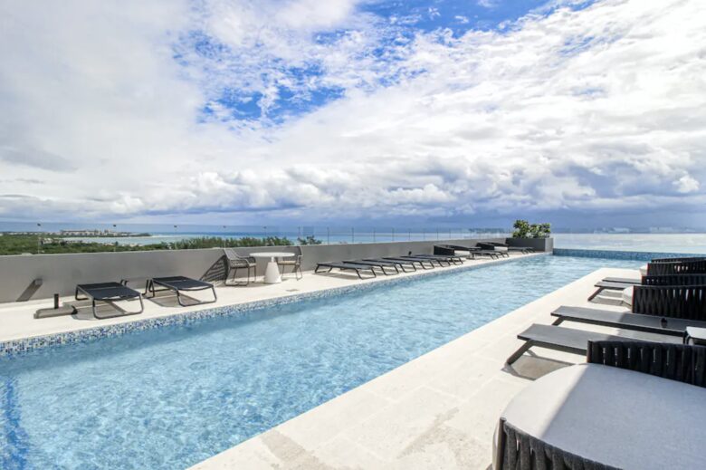 Singular Dreams Modern Beach Condo | Ocean-view with roof deck, pool, & private balcony - walk to beach - Playa del Carmen, Mexico