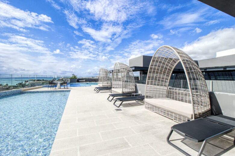 Singular Dreams Modern Beach Condo | Ocean-view with roof deck, pool, & private balcony - walk to beach - Playa del Carmen, Mexico