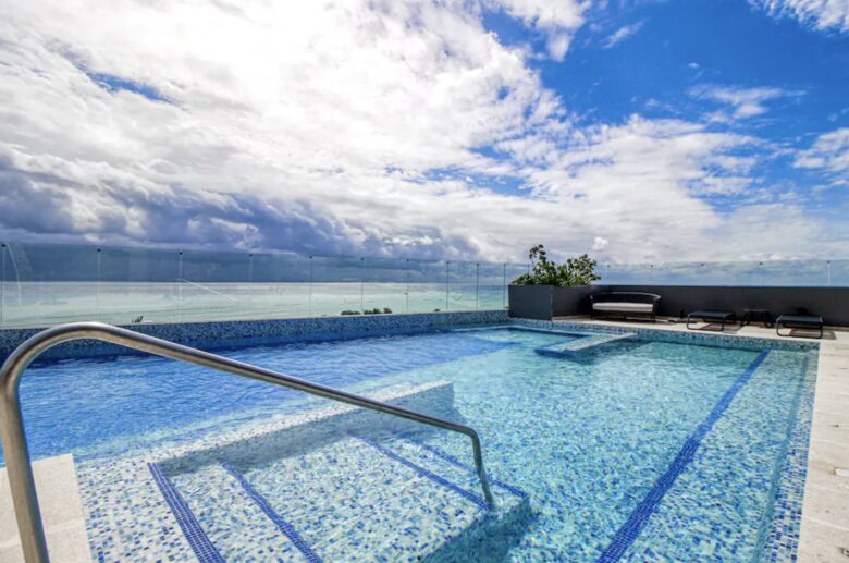 Singular Dreams Modern Beach Condo | Ocean-view with roof deck, pool, & private balcony - walk to beach - Playa del Carmen, Mexico