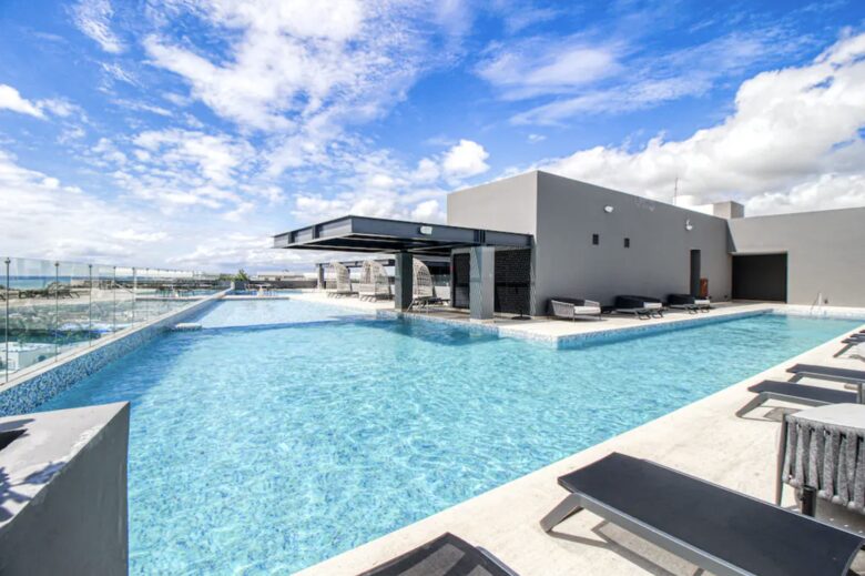 Singular Dreams Modern Beach Condo | Ocean-view with roof deck, pool, & private balcony - walk to beach - Playa del Carmen, Mexico