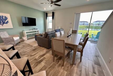 Dining room and living room with waterfront views