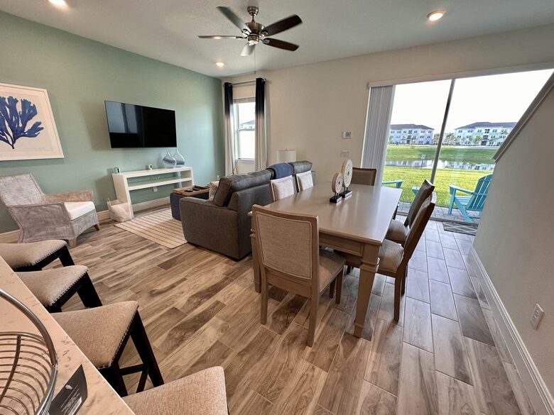 Dining room and living room with waterfront views