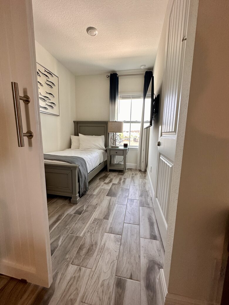 Third room. Twin size bed and twin size rolling under bed..