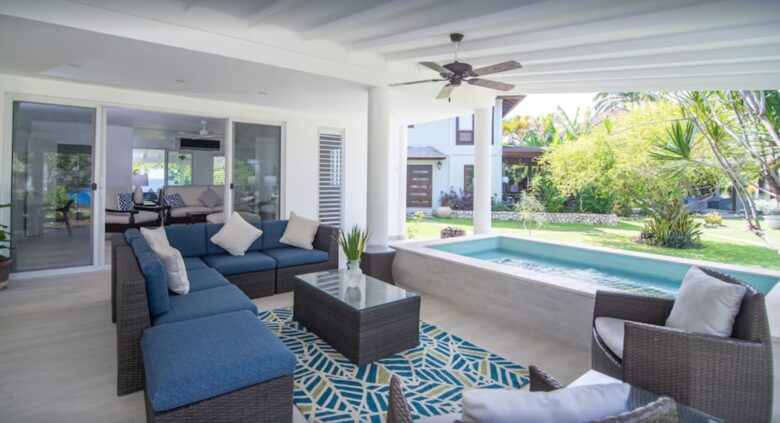 Private patio with lounge chairs and dining