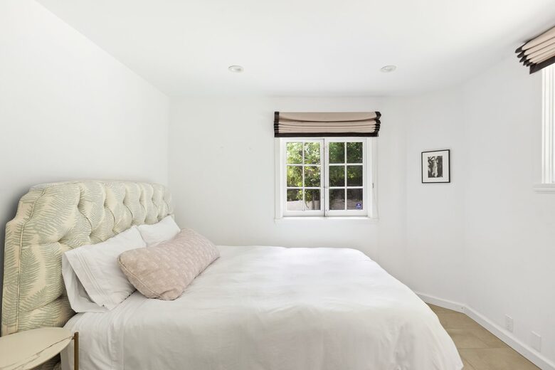 Lower level guest room with queen bed and private bath