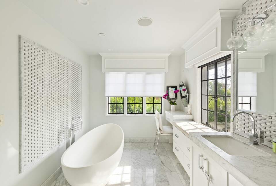 Master bathroom with tub and steam shower