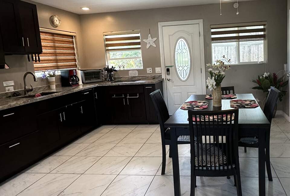 Kitchen with table that pulls out and extends to sit 8