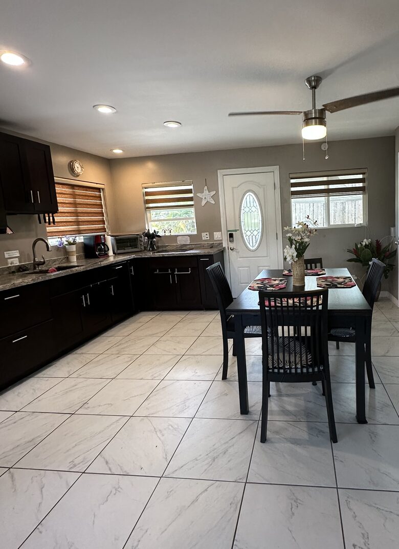 Kitchen with table that pulls out and extends to sit 8