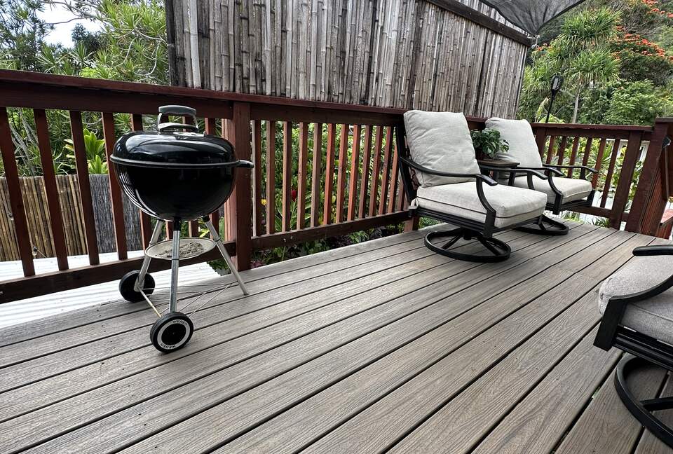 Private porch with BBQ and a view of the Pūpūkea Forest Reserve