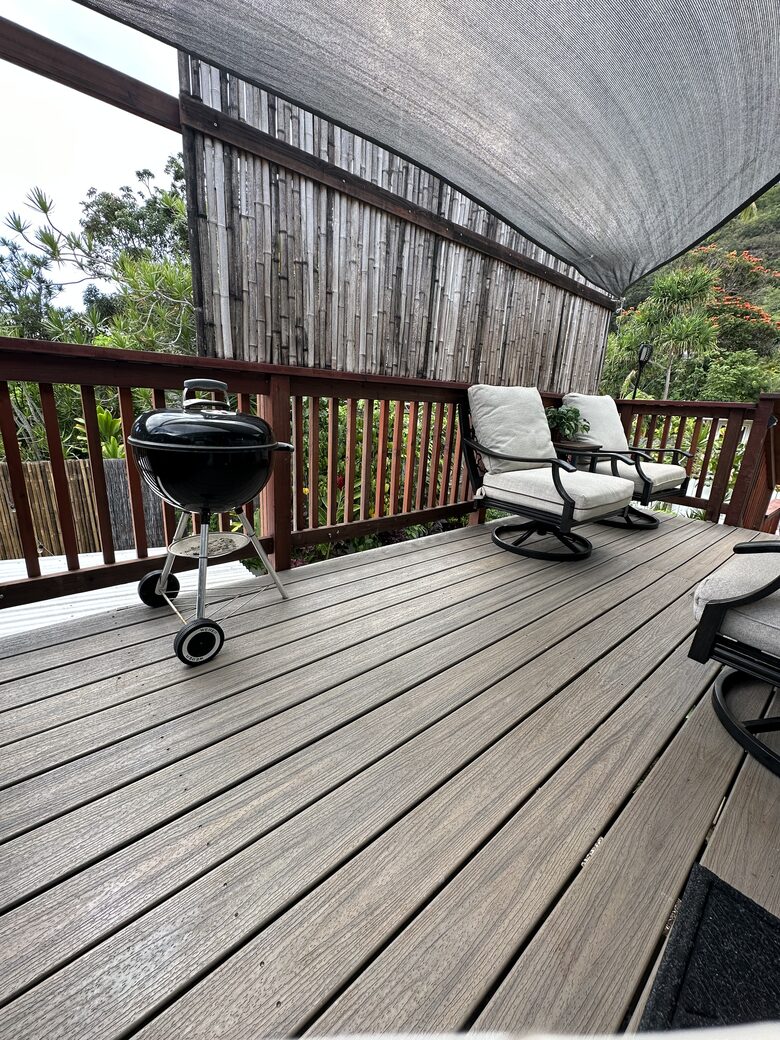 Private porch with BBQ and a view of the Pūpūkea Forest Reserve