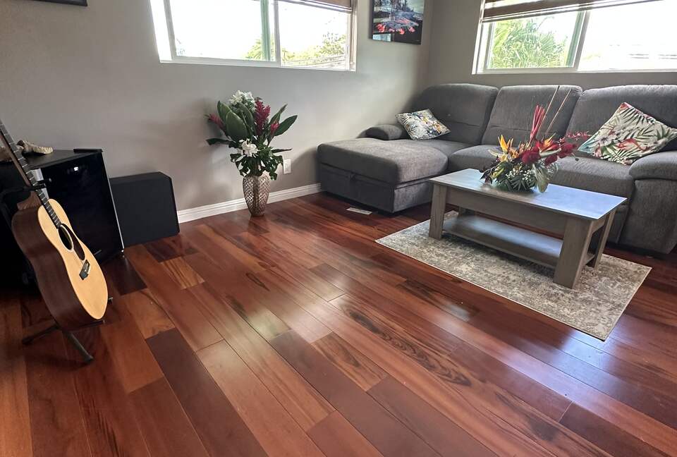 Living room with TV and sofa that pulls out to double bed