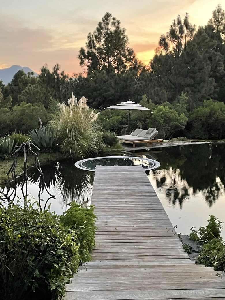 Hot tub inside natural swimming Pool.