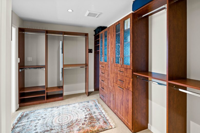 Walk in closet with folding mirror