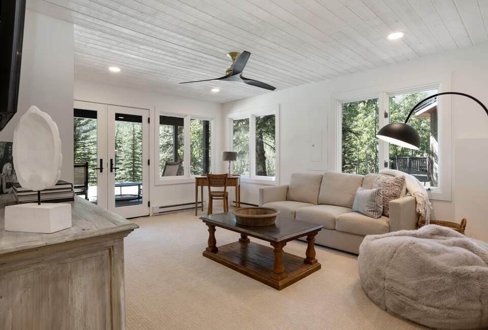downstairs living area with pull-out sofa, SMART TV, patio