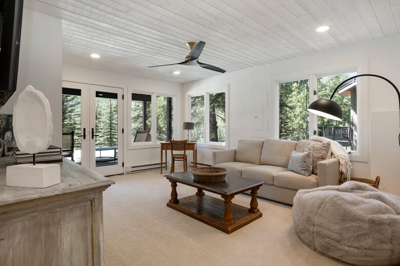 downstairs living area with pull-out sofa, SMART TV, patio