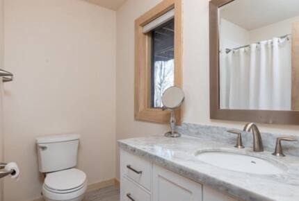 The first of two ground floor full bath with tub and shower