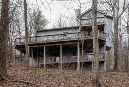 Back of the home with 3 decks including master bedroom deck.