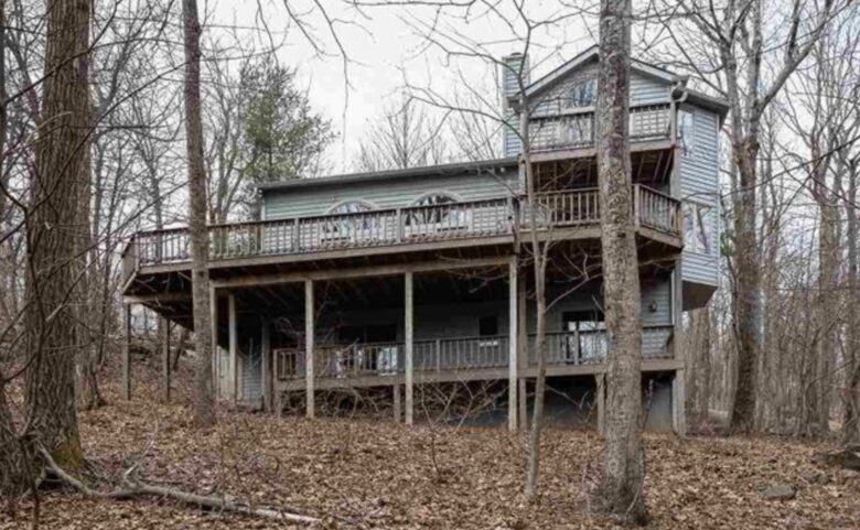 Back of the home with 3 decks including master bedroom deck.
