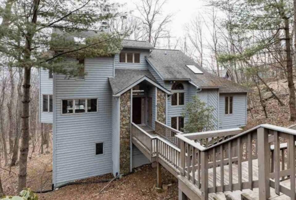 Just steps from a private driveway is the home's entrance.