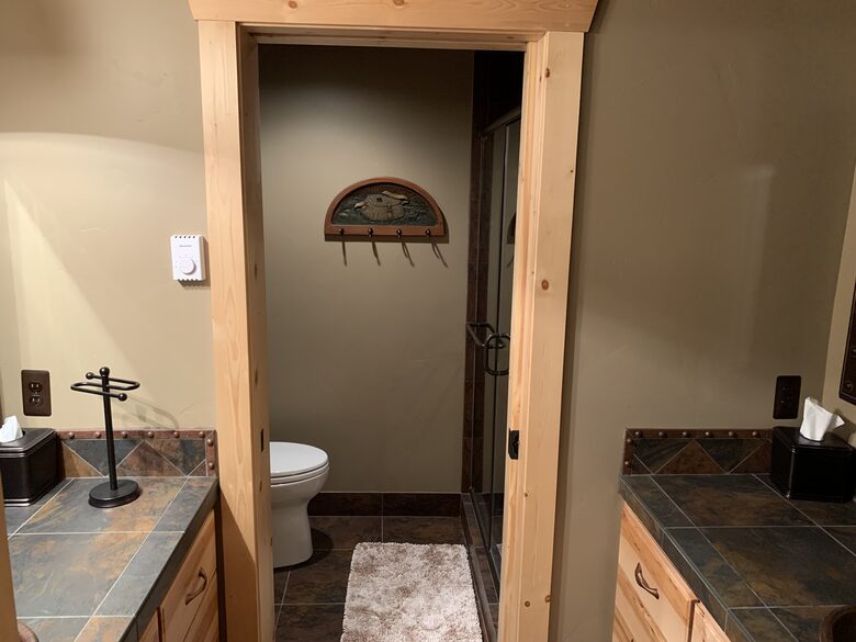 Downstairs bathroom with double vanities