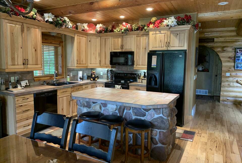 Kitchen with appliances, spice rack, blender, coffee maker