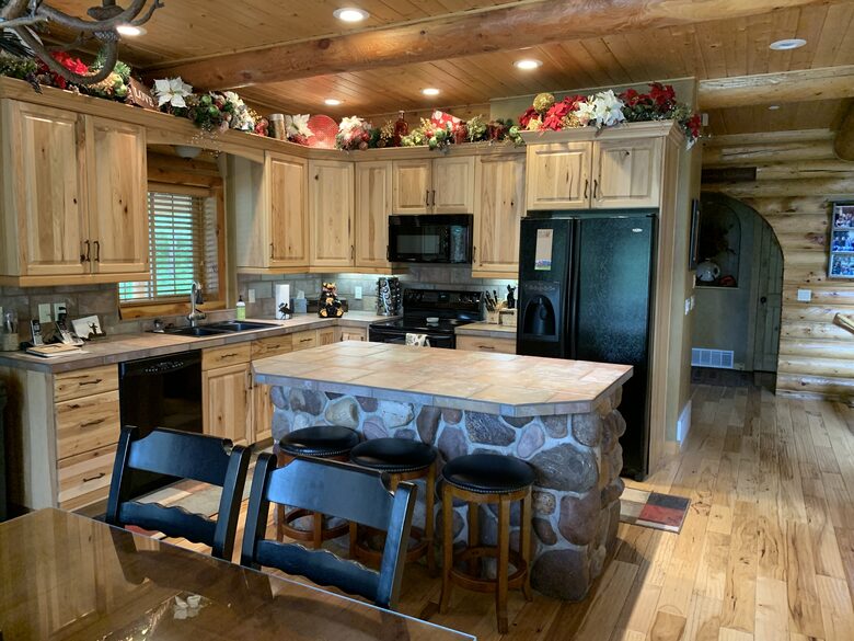 Kitchen with appliances, spice rack, blender, coffee maker
