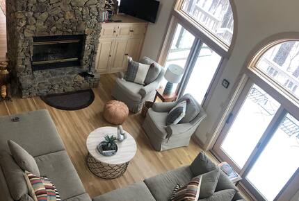 A look at the main family room with wood-burning fireplace