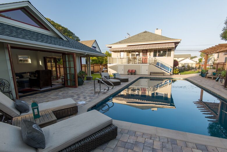 Pool, cabana and back of home