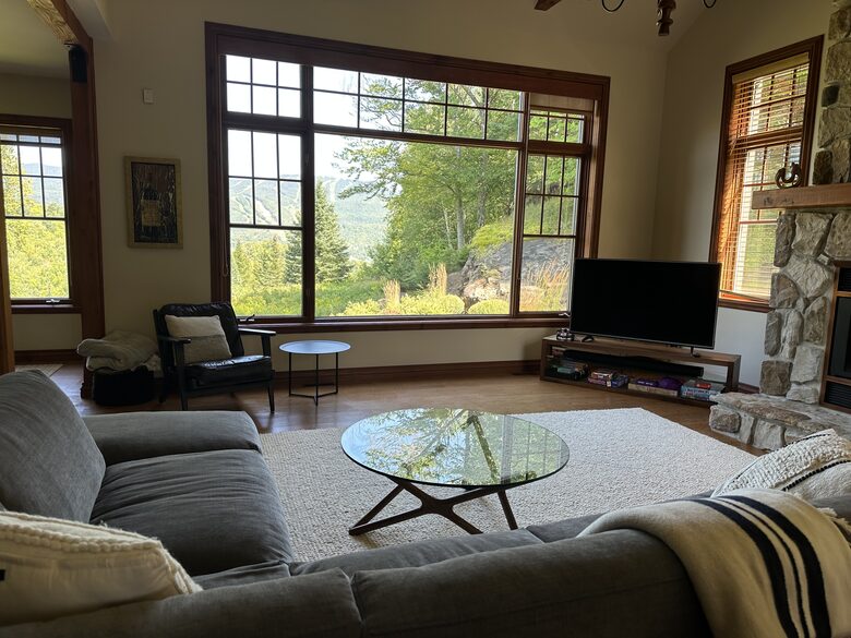 Living room with fireplace and view of the mountain