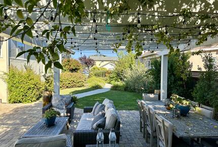 BBQ area and yard w/ fruit trees & vines
