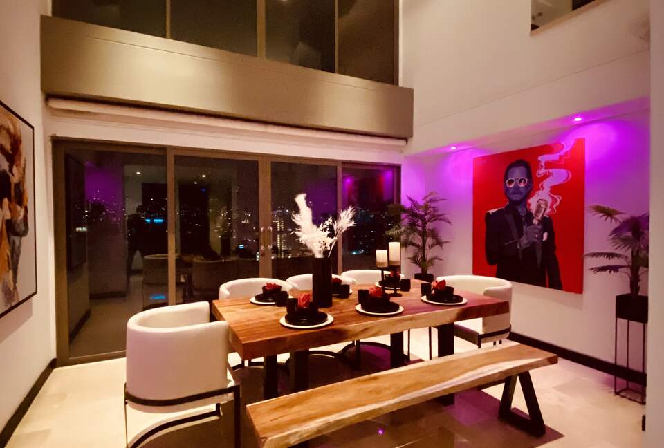 Dining room with double high ceiling