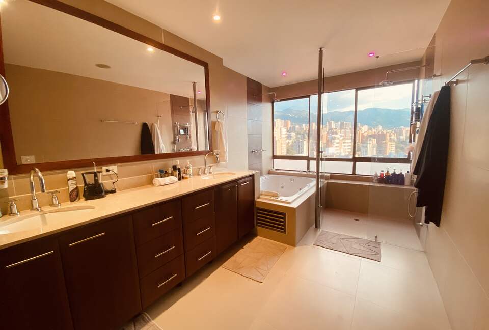 Master bathroom with dual shower and jacuzzi tub