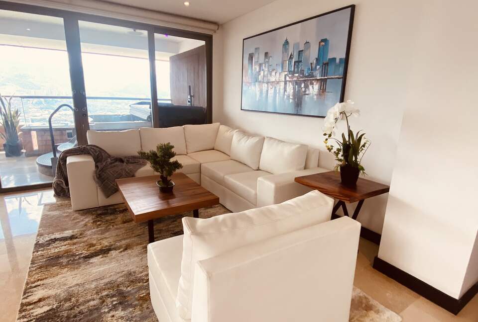 Living room with access to large wrap around balcony