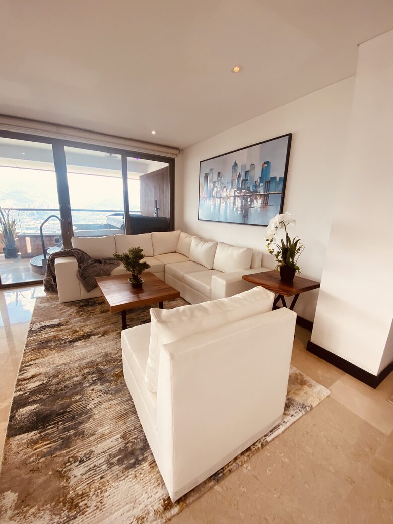 Living room with access to large wrap around balcony