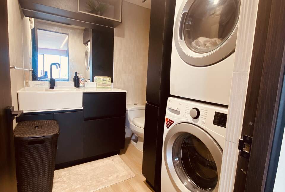 Laundry area with full size Washer & Dryer and half bathroom