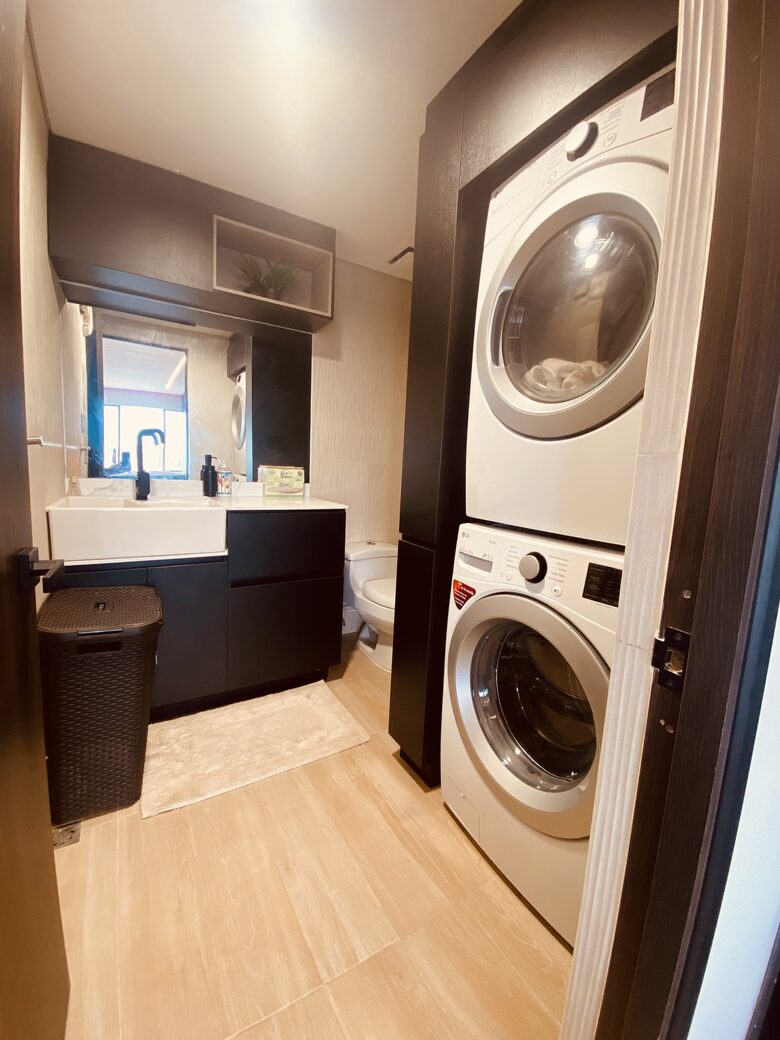 Laundry area with full size Washer & Dryer and half bathroom