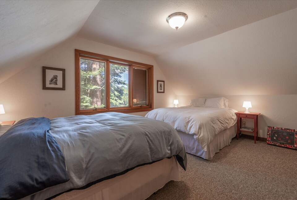 Guest bedroom with two queen beds.