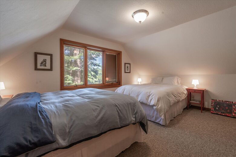 Guest bedroom with two queen beds.