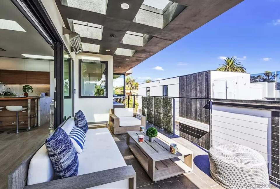 upper deck next to kitchen with pass through bar, beach view